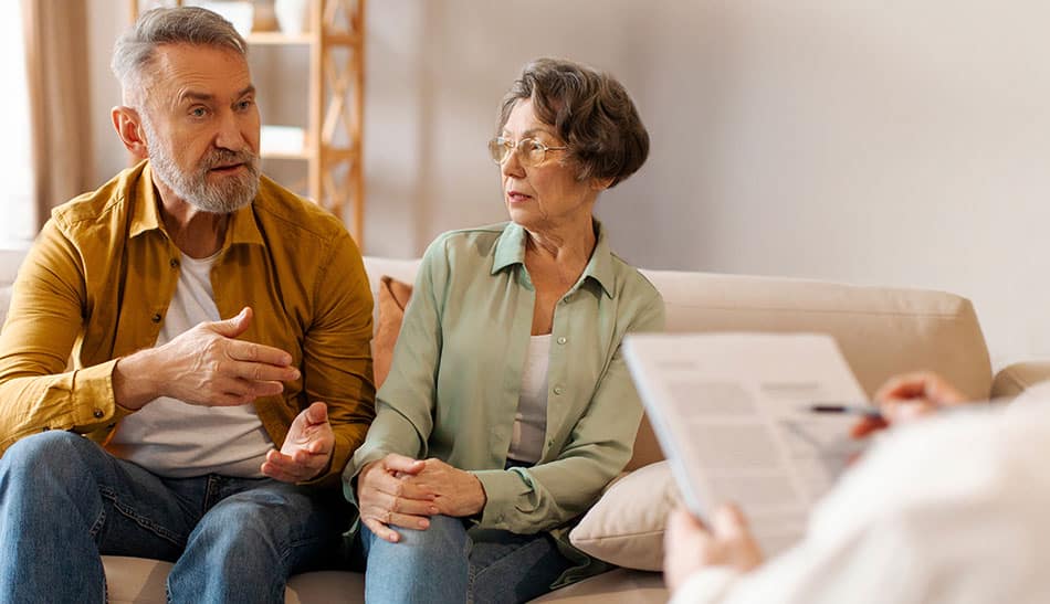 Why Seniors and Their Families Benefit from a Senior Real Estate Specialist? Senior couple working with SRES Designated realtor